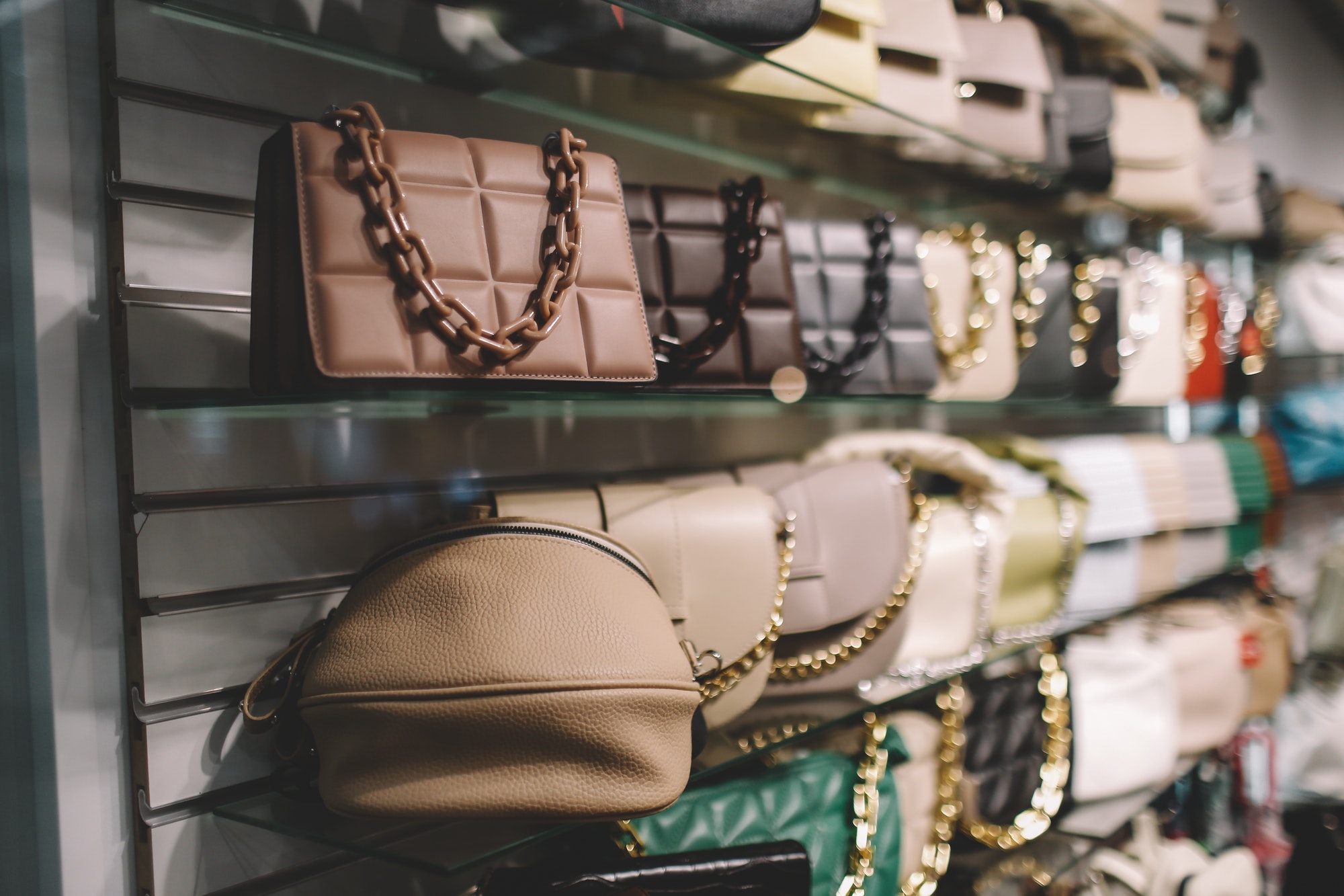 A display of handbags in a retail store.